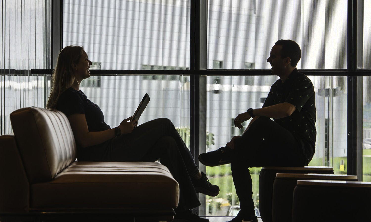 Coworkers sharing discussion laughing